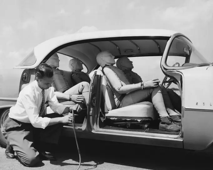 Side profile of a mid adult man preparing for an auto safety test