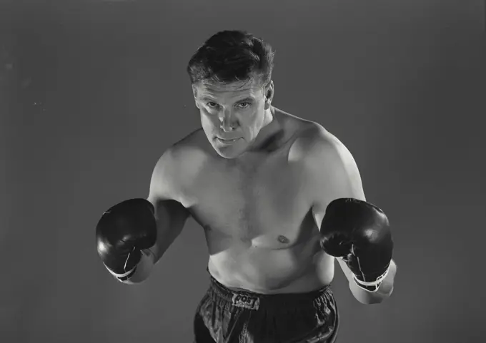 Vintage Photograph. Boxer in fighting stance with gloves up