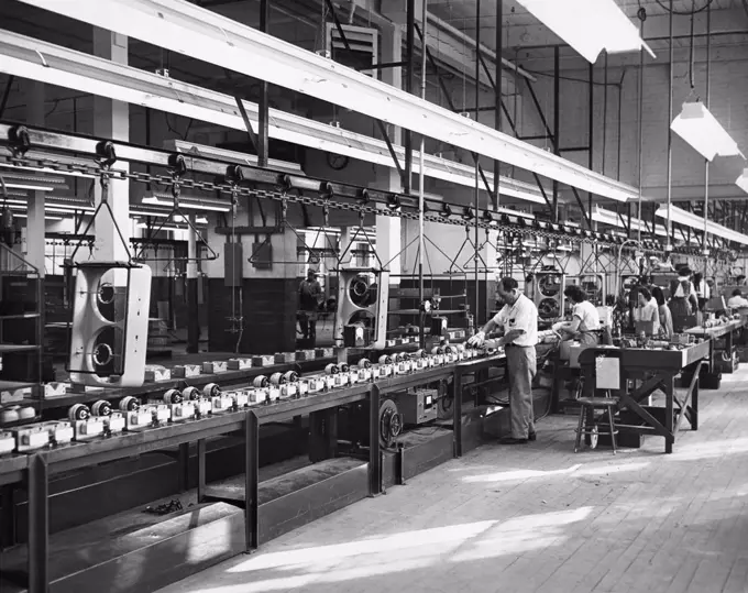 Manual workers working in an assembly line