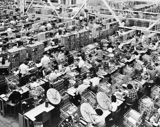 High angle view of manual workers working in an industry, North American Aviation, California, USA