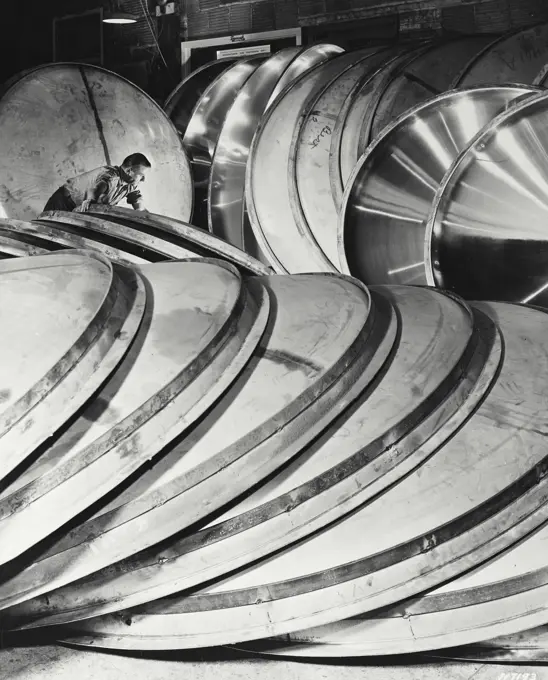 Vintage photograph. Stainless steel tank ends for milk storage