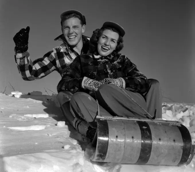 Young couple sleighing