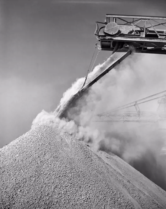 Low angle view of a conveyor belt unloading bauxite from a ship, Mobile, Alabama, USA