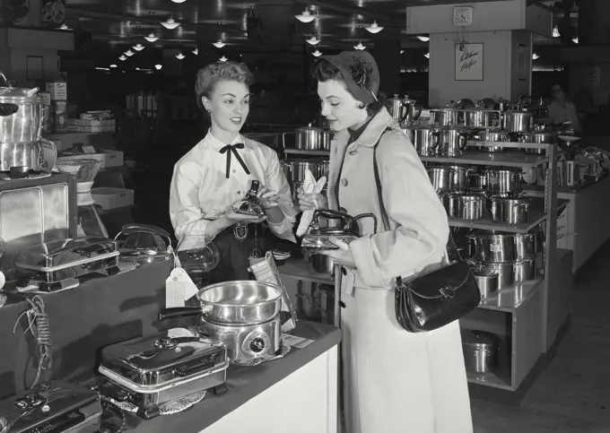 Vintage Photograph. Woman shopping for new iron