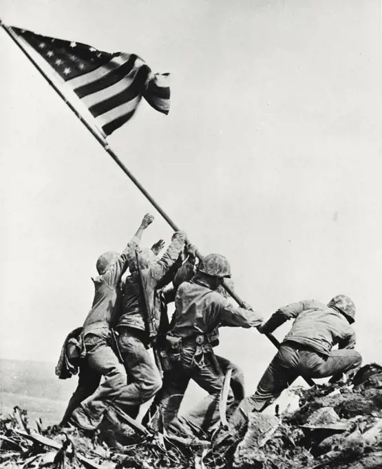 Vintage photograph. Army soldiers raising flag on mount Suribachi, Iwo Jima