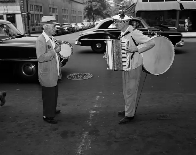 Two senior men playing on street