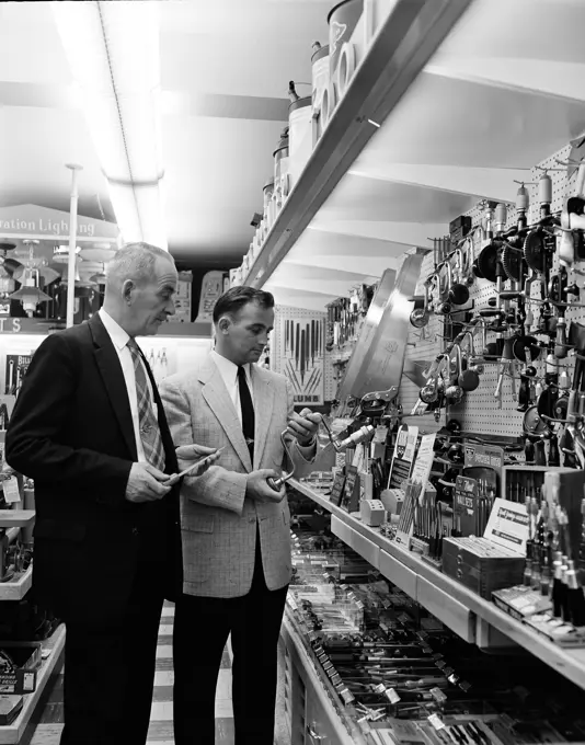 Man choosing tools in hardware store