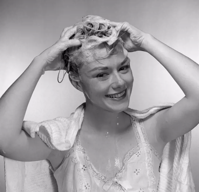 Mid adult woman washing hair