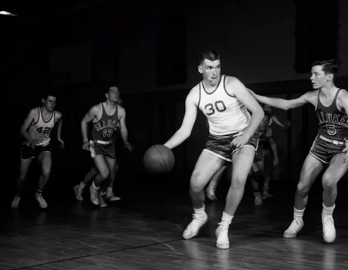 Men playing basketball