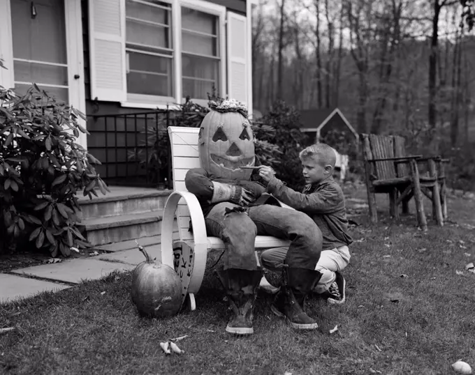 Boy preparing Halloween decoration