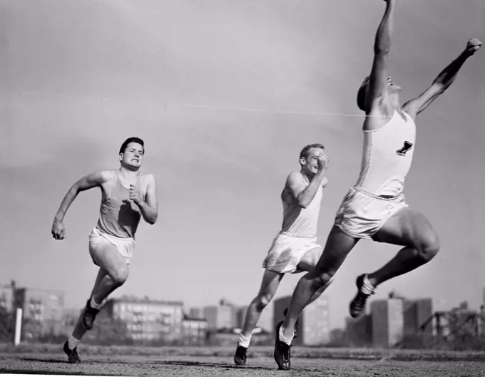 Three athletes running