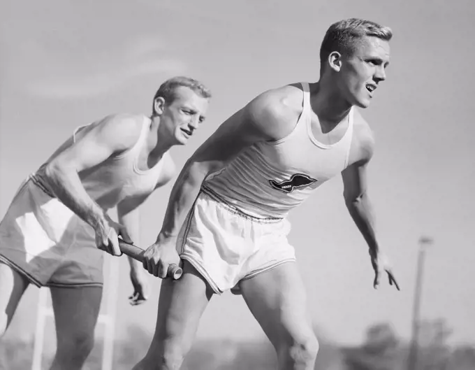 Two men running on relay