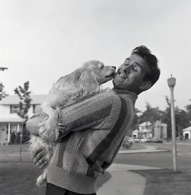 Man hugging dog