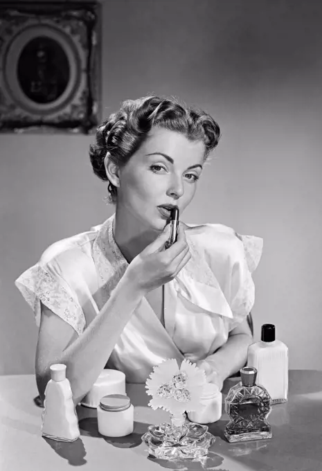 Woman applying make-up