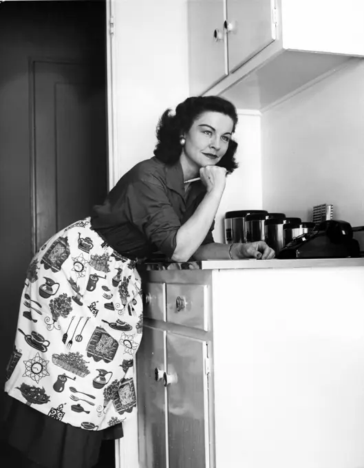 Woman preparing to do list in kitchen