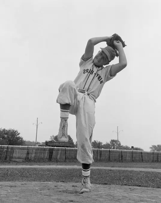 Boy playing baseball ready to throwing ball