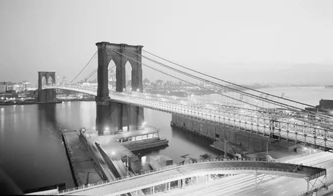 USA, New York State, New York City, Night view of Brooklyn Bridge with Brooklyn in background from Manhattan side