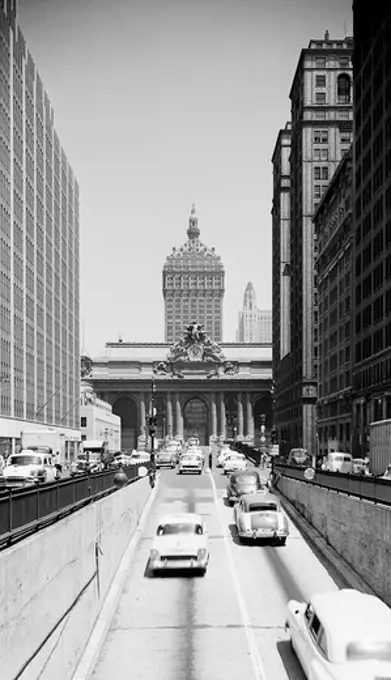 USA, New York State, New York City, View looking North on Park Avenue over ramp from vehicle tunnel, showing Grand Central Terminal and New York Central building in background