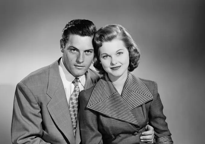 Portrait of young couple, studio shot