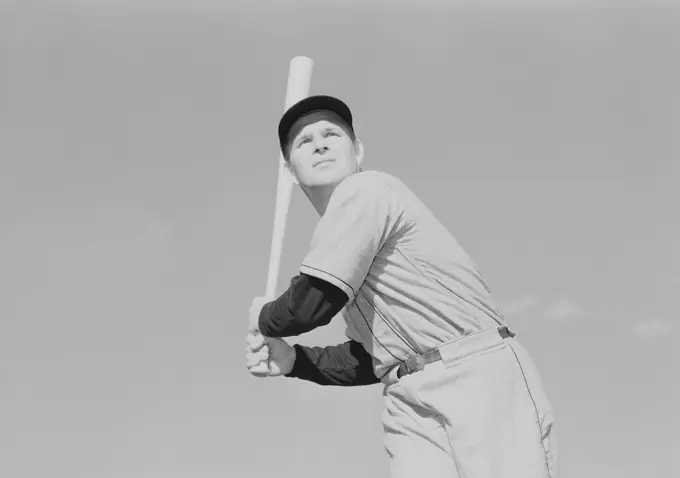 Mid adult man playing baseball