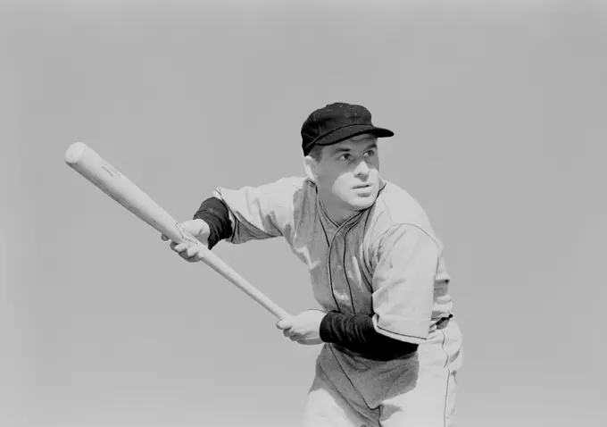 Mid adult man playing baseball