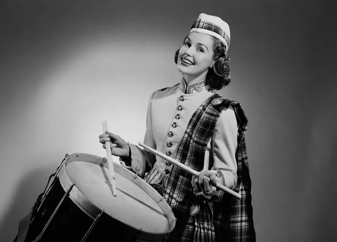 Young woman playing drum