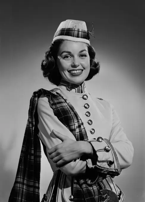 Portrait of young woman wearing uniform