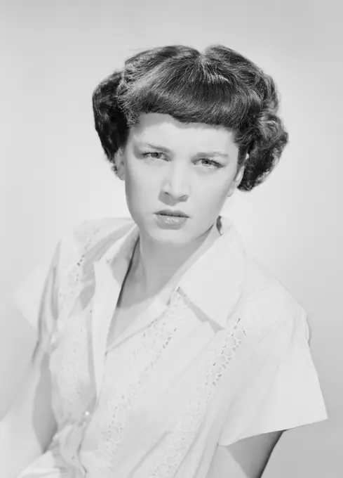 Studio portrait of angry young woman