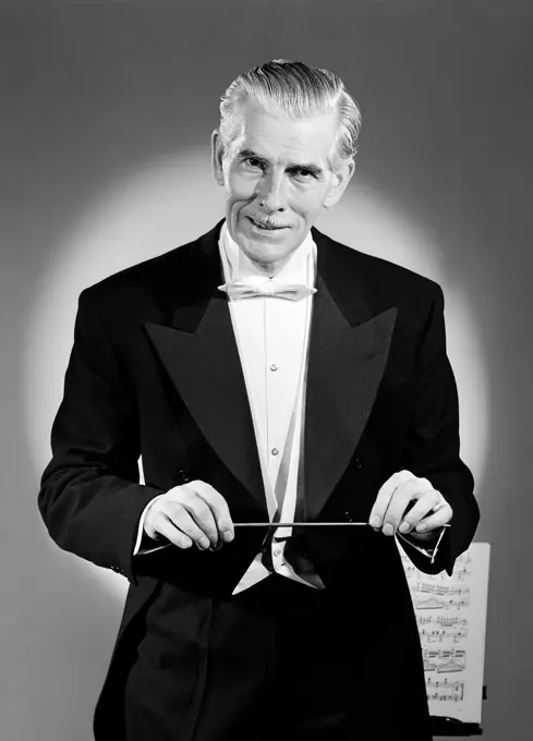 Studio portrait of classical music conductor