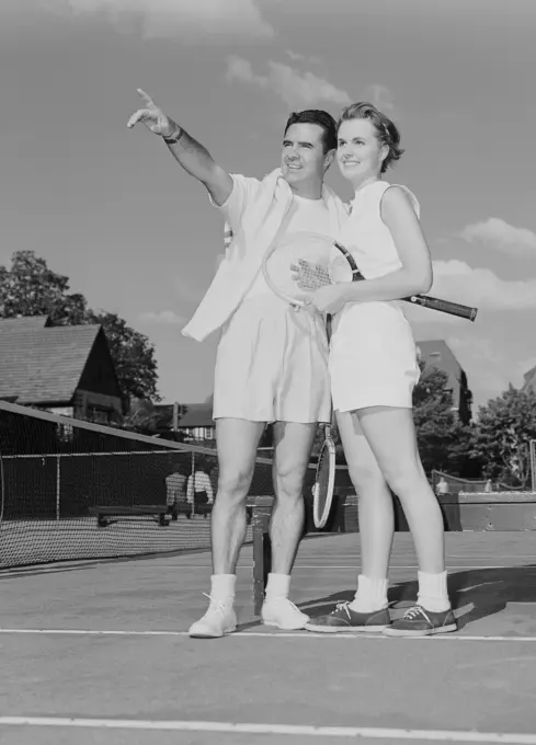 Young couple at tennis court