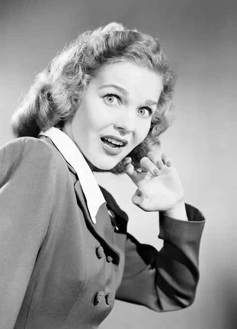 Studio portrait of shocked young woman