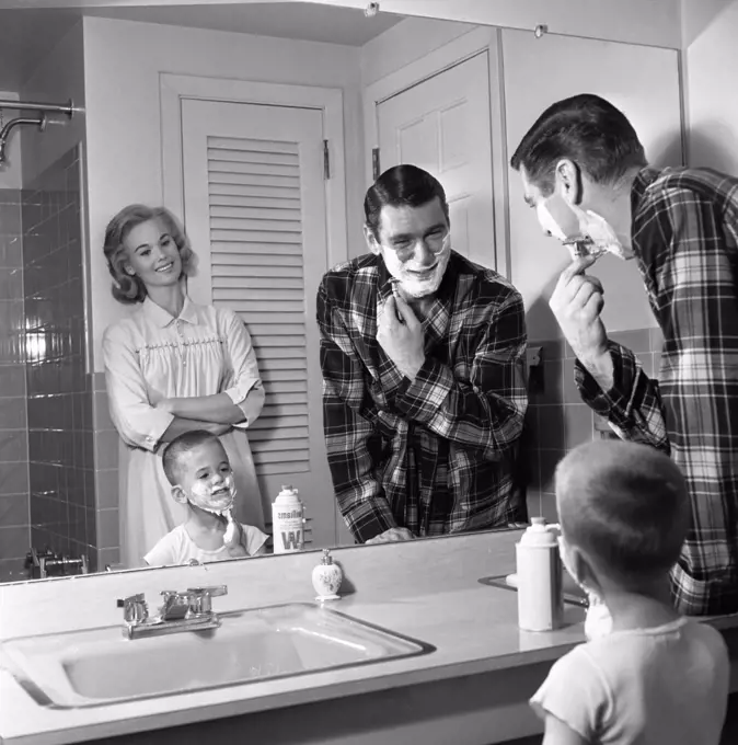 Mother father and son in bathroom