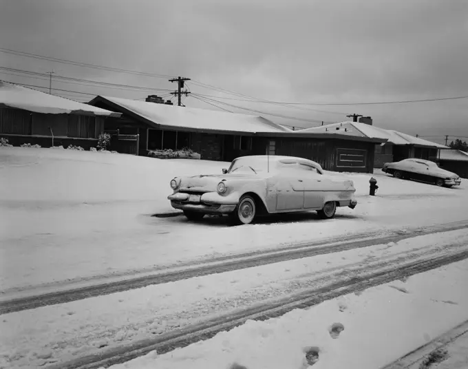 USA, Seattle neighborhood street with cars after snowfall