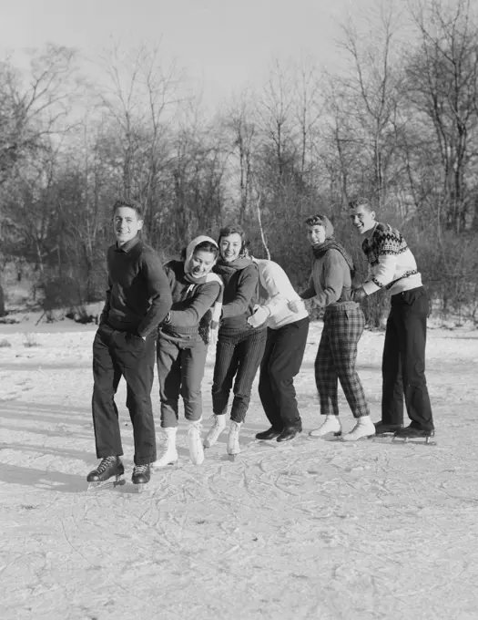 Group of friends ice-skating