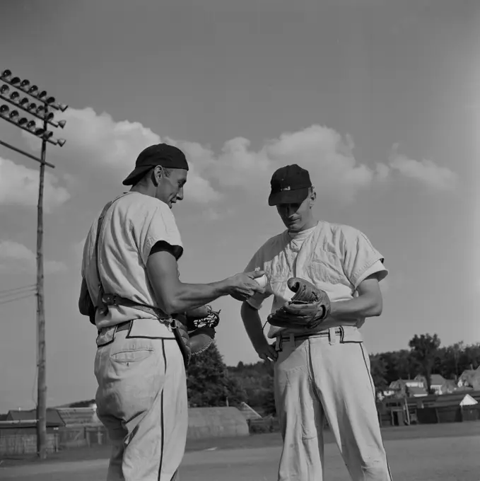 Two baseball players talking