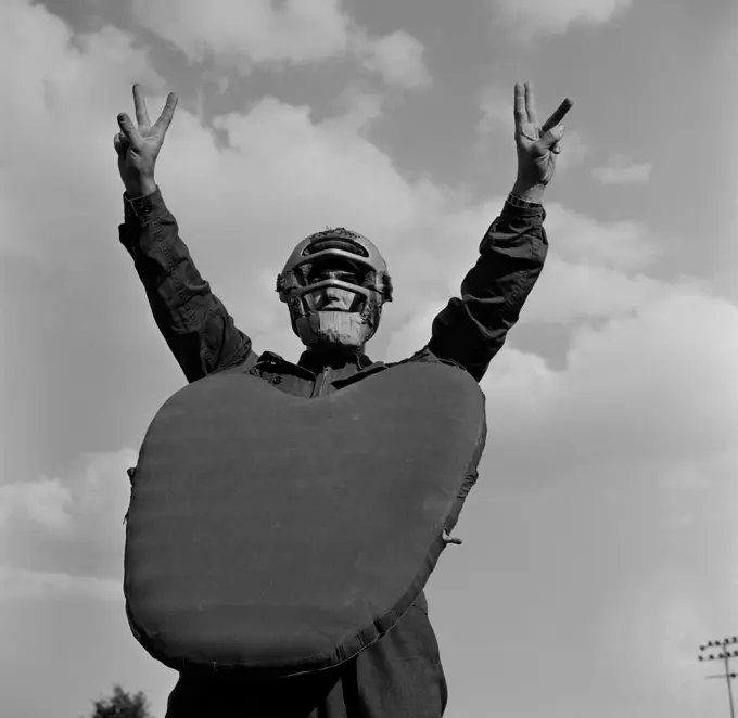 Baseball player wearing helmet and chest protector