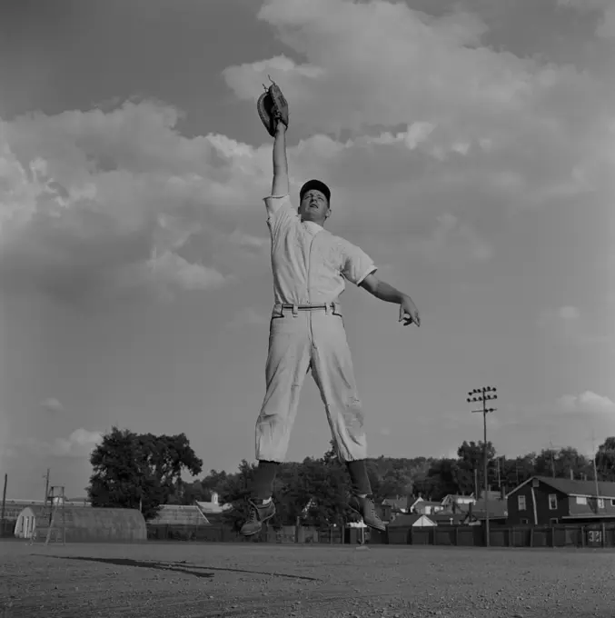 Baseball catcher jumping