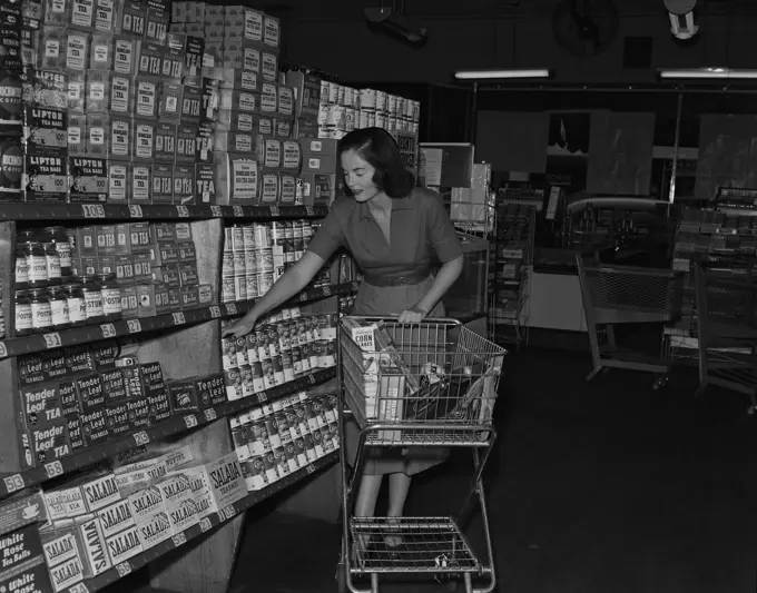 Young woman shopping in supermarket