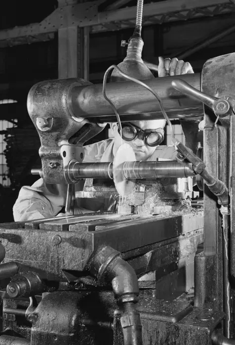 Man working on machine in factory