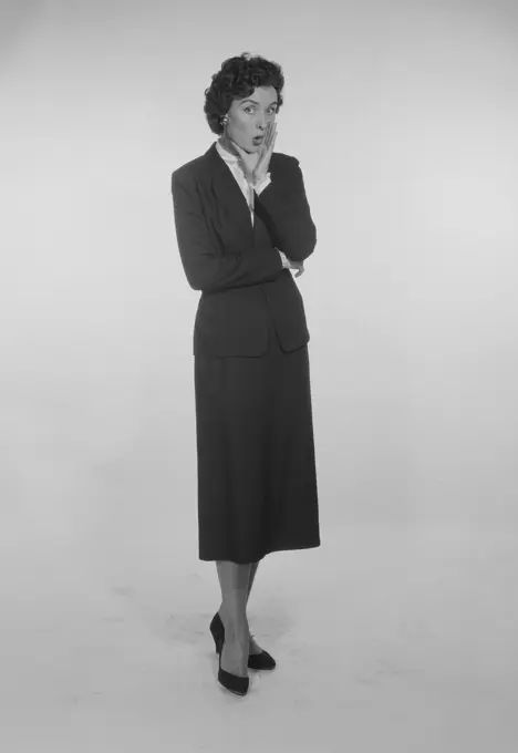 Studio Portrait of a mid adult woman gesturing