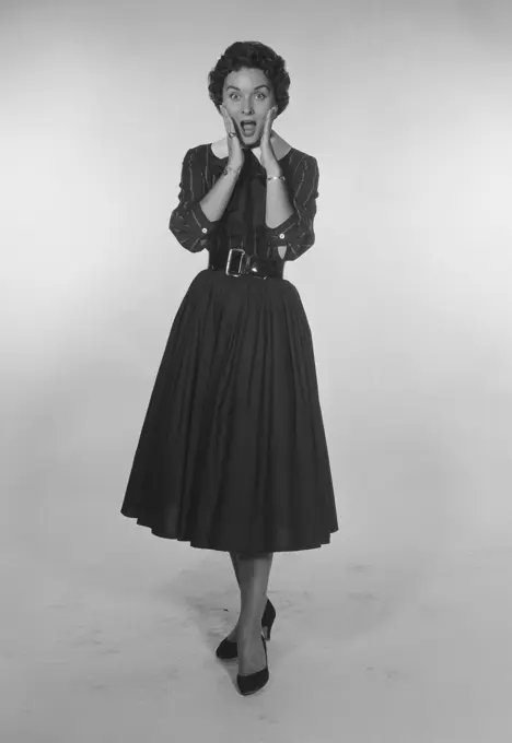 Studio Portrait of a mid adult woman gesturing