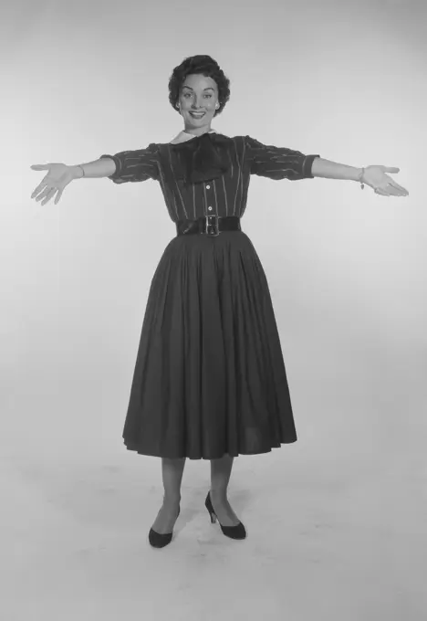 Studio Portrait of a mid adult woman gesturing