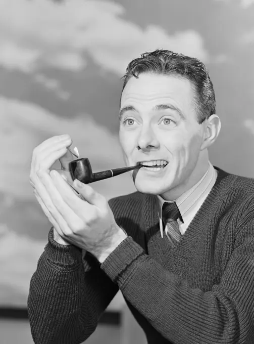 Man smoking pipe outdoors