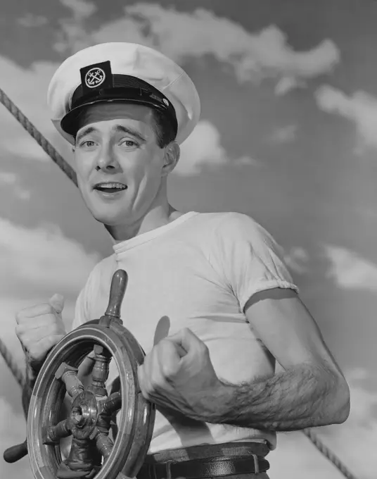 Portrait of sailor steering ship