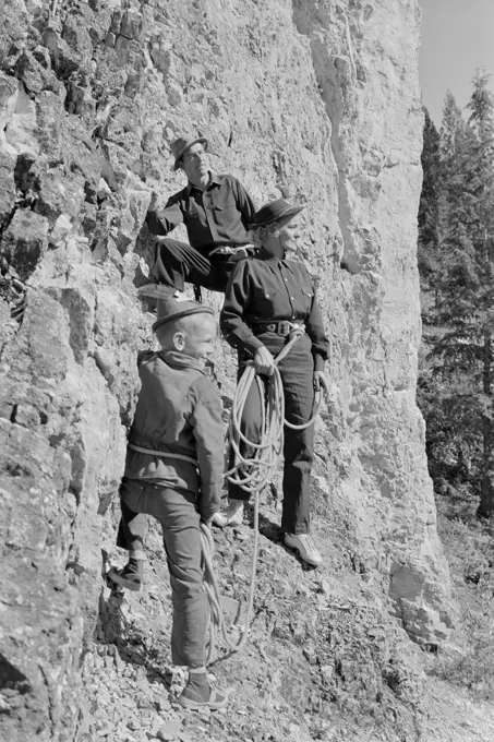 family with boy on mountain excursion