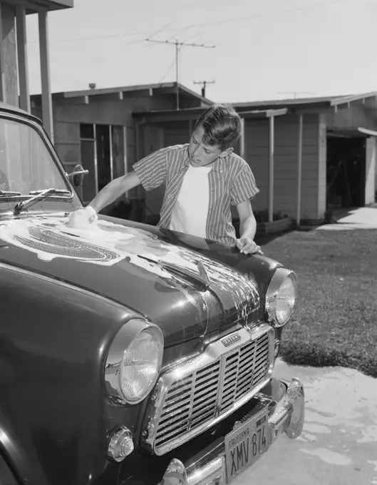 Boy washing car