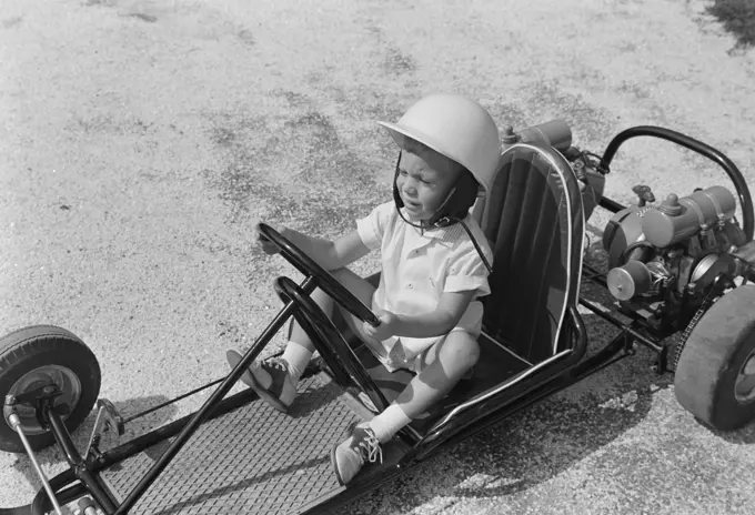 Boy sitting in gocart