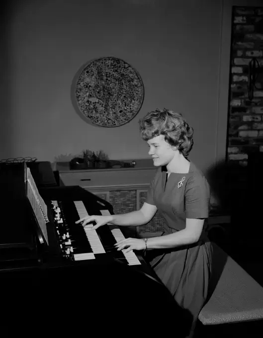 Teenage girl playing organ