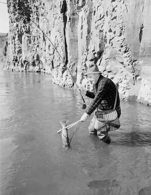 Senior man fly-fishing