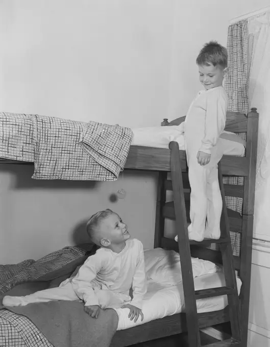 Boys on double storey plunk bed